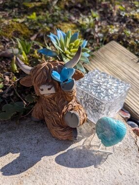 Highland Cow Lounging Garden Decor Blue Butterfly